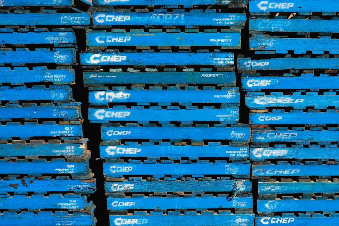 a pile of blue crates stacked on top of each other