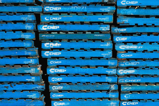 a pile of blue crates stacked on top of each other