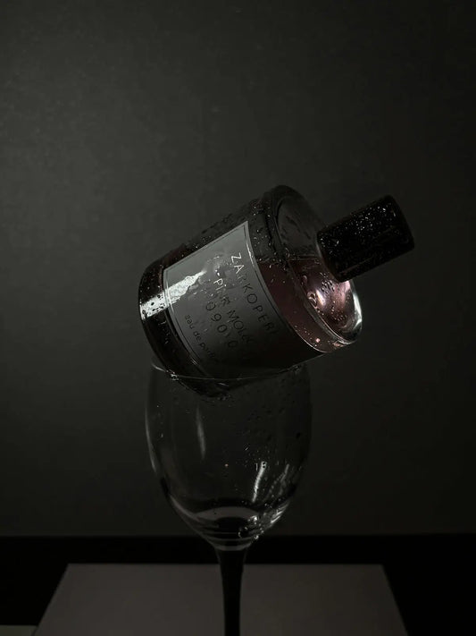 a wine glass with a bottle of wine in it
