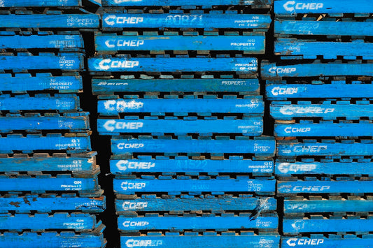 a pile of blue crates stacked on top of each other