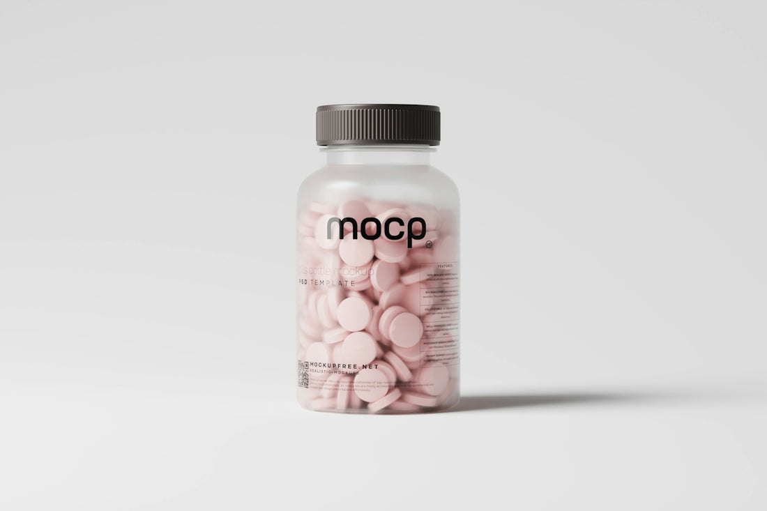 a bottle of pink pills sitting on top of a white table