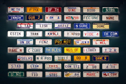 A large number of license plates on a wall