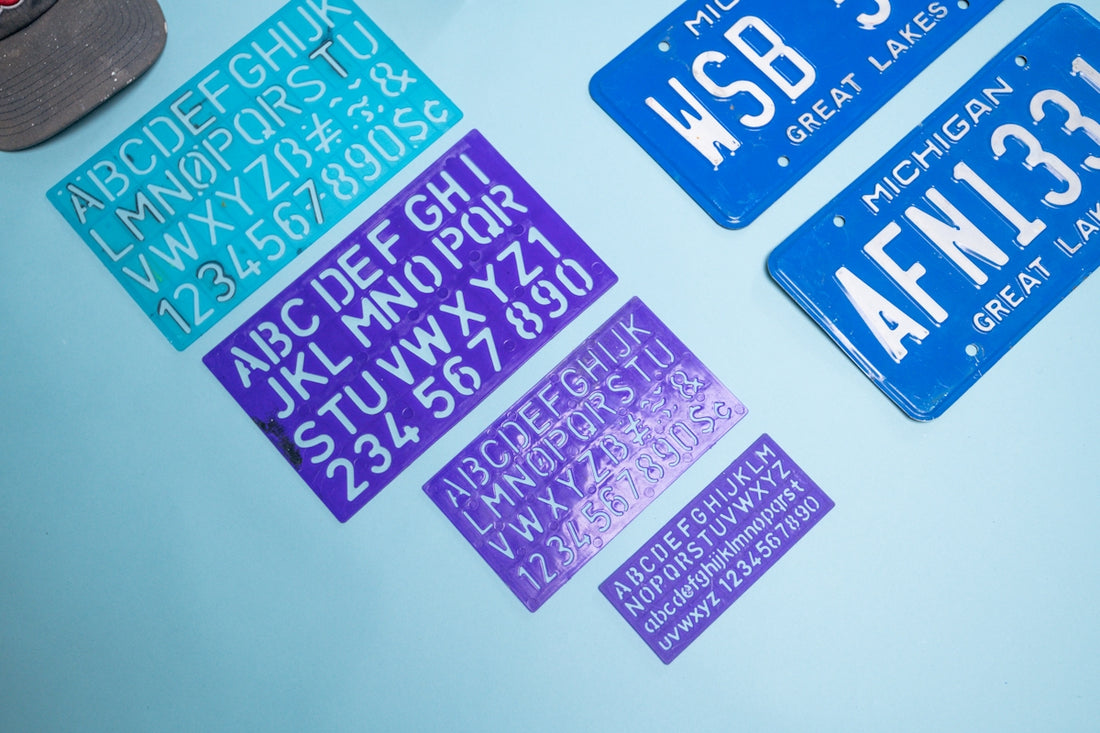 Sheets of alphabet and number stickers and license plates
