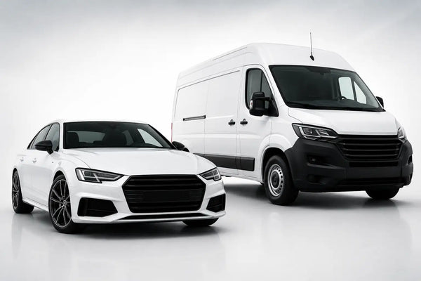 White audi sedan and van with sleek black accents on the grille, wheels, and trim.